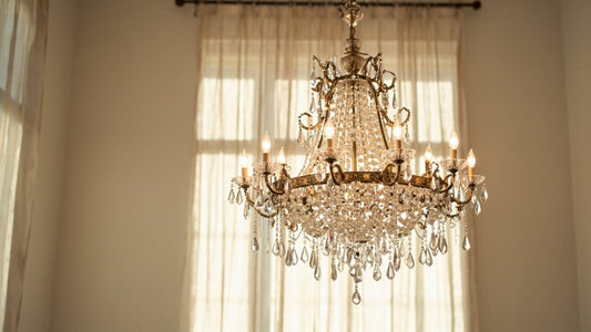 artisan brass chandelier with crystal and alabaster glowing in elegant neutral room
